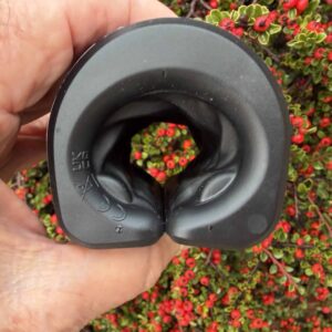 Arcwave Zing Stroker pictured besides a flower bush.