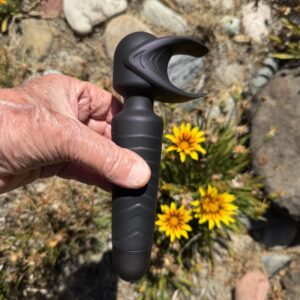 Male hand holding Evo penis toy