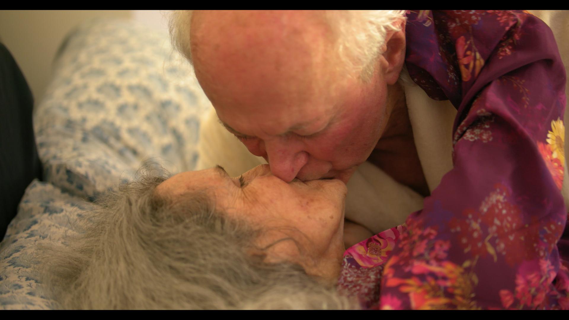 Mac kissing Joan